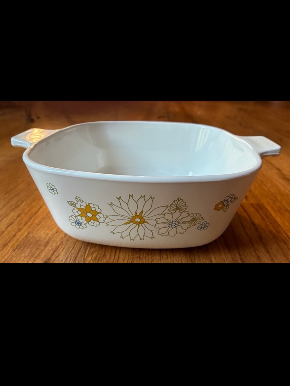 Corningware White Casserole with Yellow Floral Motif on both sides.  1-1/2 quart